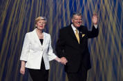 RI President John Kenny and his wife, June, welcome attendees at the opening plenary session of the 101st RI Convention in Montral, Qubec, Canada, on 20 June.